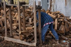 Work Hand Filling a Wood Rack
